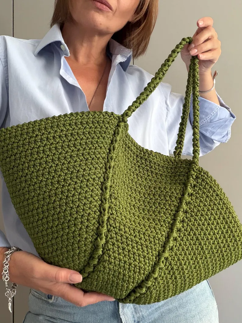 Side view of the handmade Aura crochet hobo bag showing its depth